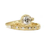 Scalloped bezel engagement ring with ribbed scallop band